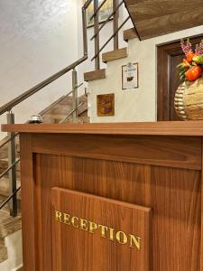 a podium with a reception sign on top of it at RELAX - Guest House Varshets in Varshets