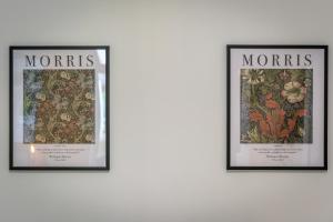 three framed posters on a wall with flowers at Wood House - 5 Beds, Suitable for contractors in Kettering