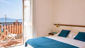 Posteľ alebo postele v izbe v ubytovaní Hotel Il Telamonio