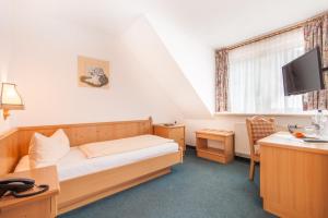TV a/nebo společenská místnost v ubytování Hotel und Restaurant Piccolo