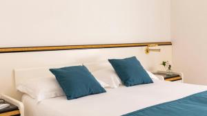 Posteľ alebo postele v izbe v ubytovaní Hotel Il Telamonio
