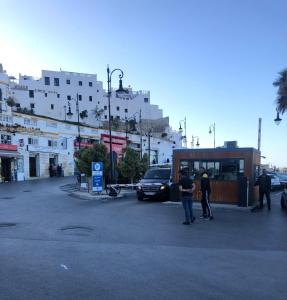 a group of people standing in a parking lot at Dar hanae tanger in Tangier