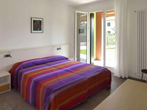 מיטה או מיטות בחדר ב-Appartamenti Faro Vecchio