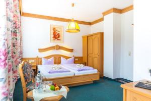 Katil atau katil-katil dalam bilik di Hotel und Restaurant Piccolo
