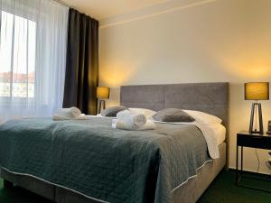 Posteľ alebo postele v izbe v ubytovaní A-Austerlitz Hotel