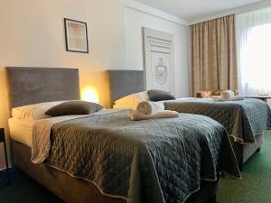 Posteľ alebo postele v izbe v ubytovaní A-Austerlitz Hotel