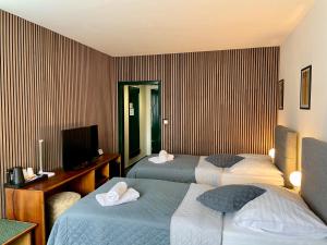Posteľ alebo postele v izbe v ubytovaní A-Austerlitz Hotel