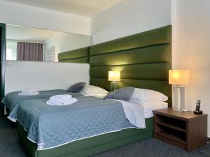Posteľ alebo postele v izbe v ubytovaní A-Austerlitz Hotel