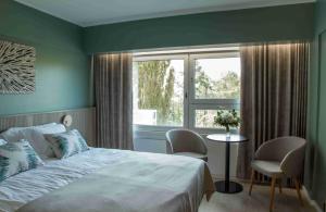 Кровать или кровати в номере Ruissalo Spa Hotel