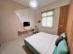 Uma cama ou camas num quarto em 澎湖樂在綺中民宿 第580號