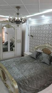 Cama o camas de una habitación en Квартира посуточно 1 ком Шымкент