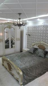 Cama o camas de una habitación en Квартира посуточно 1 ком Шымкент