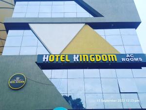 a sign for a hotel kingdom on the side of a building at HOTEL KINGDOM in Gandhinagar