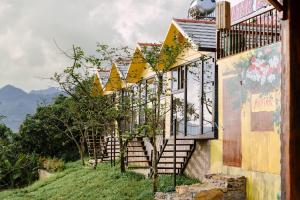 a row of houses with stairs on a hill at Avatar Homestay & Coffee - Mộc Châu in Mộc Châu