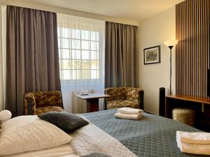 Posteľ alebo postele v izbe v ubytovaní A-Austerlitz Hotel