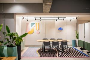 a meeting room with a table and chairs at CampusKey Cape Town in Cape Town