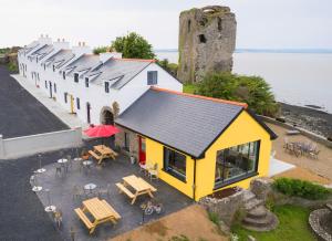 an aerial view of a building with tables and chairs at Shannon Castle Holiday Cottages - Type D 