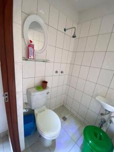 a small bathroom with a toilet and a sink at Aeropark Residencial(1) in Maputo