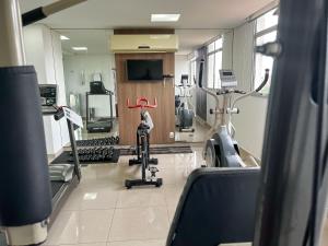 a gym with two treadmills and a treadmill at Nobile Hotel Belo Horizonte in Belo Horizonte