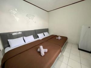 Ліжко або ліжка в номері Vila Nio