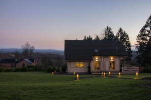 a small house with lights in the yard at Durbuy Villa Valentina in Durbuy