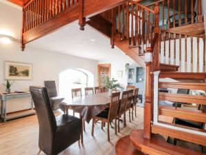 a dining room with a table and chairs at Shieldhill Farm House in Falkirk