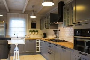 a kitchen with gray cabinets and a counter top at Durbuy Villa Valentina in Durbuy