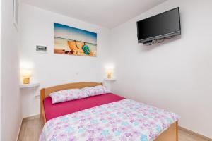 Postel nebo postele na pokoji v ubytování Apartments Tea