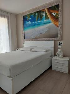 Ένα ή περισσότερα κρεβάτια σε δωμάτιο στο Residence Jesolo Lido centro con piscina