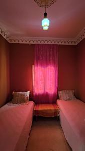 Ένα ή περισσότερα κρεβάτια σε δωμάτιο στο Myhouse Todgha