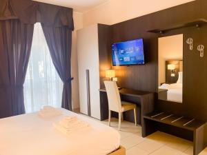 A bed or beds in a room at Brain Apartment Pagani