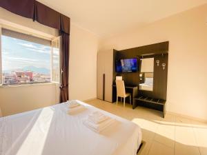 A bed or beds in a room at Brain Apartment Pagani