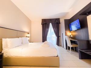 A bed or beds in a room at Brain Apartment Pagani