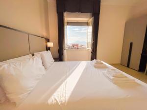 A bed or beds in a room at Brain Apartment Pagani