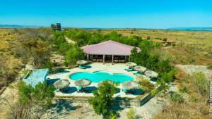 an aerial view of a resort with a swimming pool at EDEN DE LA TSIRIBIHINA in Miandrivazo