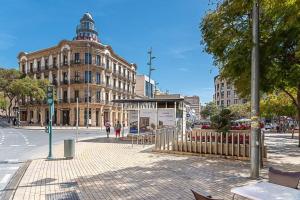 a city street with a building on the corner at Casa flamenca a los pies de la Alcazaba in Almería