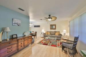 a living room with a couch and a table at Lazy Manatee Pool Home in Bradenton