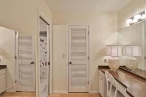 a kitchen with a counter with two vases on it at Lazy Manatee Pool Home in Bradenton