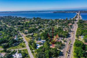 an aerial view of a town with a bridge over water at Lazy Manatee Pool Home in Bradenton