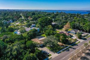 an aerial view of a town with trees and a road at Lazy Manatee Pool Home in Bradenton