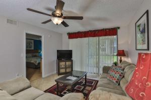 a living room with a couch and a ceiling fan at Shorewalk Condominium in Bradenton +27 photos