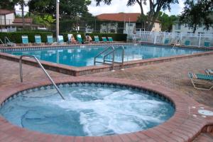 a large swimming pool with a hot tub at Shorewalk Condominium in Bradenton