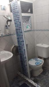 a small bathroom with a toilet and a sink at Dúplex GUMANS in Goya