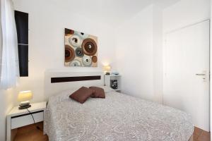 Un pat sau paturi într-o cameră la Mdc - Muralhas da Cidade