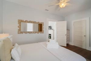 En eller flere senge i et værelse på Sunshine Bungalow