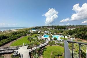 an aerial view of a resort with a swimming pool and the ocean at Sea Cloisters 409 in Hilton Head Island