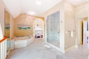 a large bathroom with a tub and a shower at The Belfry Meetinghouse in Sandwich