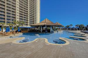 a large swimming pool with a gazebo and buildings at North Beach Villas 201 in Myrtle Beach