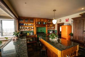 a kitchen with a refrigerator and a counter top at Royal Alfred Marina in Port Alfred