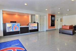 a lobby of a hotel with a reception desk and a waiting room at Motel 6-Rockport, TX in Rockport